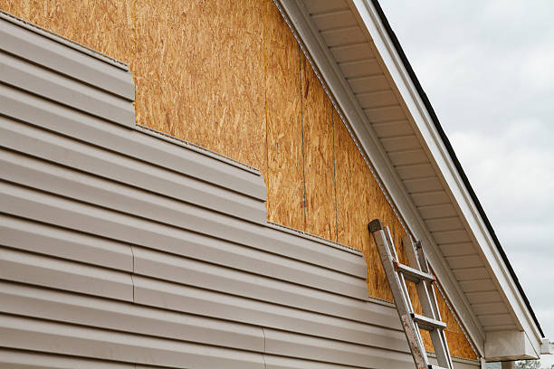 Professional Siding Replacement technician working in Highland Park, IL